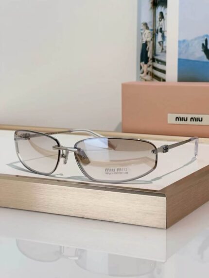 Miu Miu Slim Rectangular Rimless Sunglasses